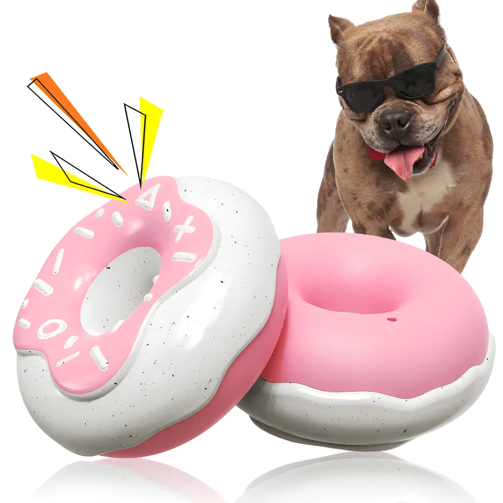 Pink, yellow, and chocolate coloured TPR donut dog toys with textured surfaces and a squeaker.