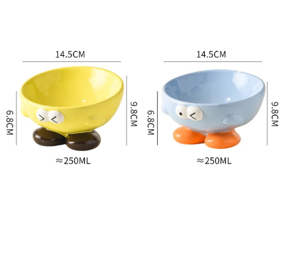 Oblique ceramic pet bowl with cute expression pattern, tall design for cervical spine protection