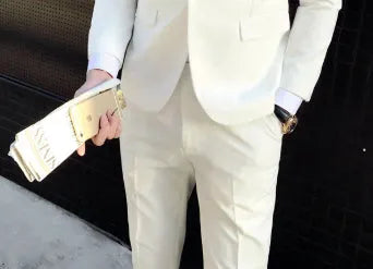 Men's white slim fit cotton blend suit set with jacket, vest, and trousers on a hanger
