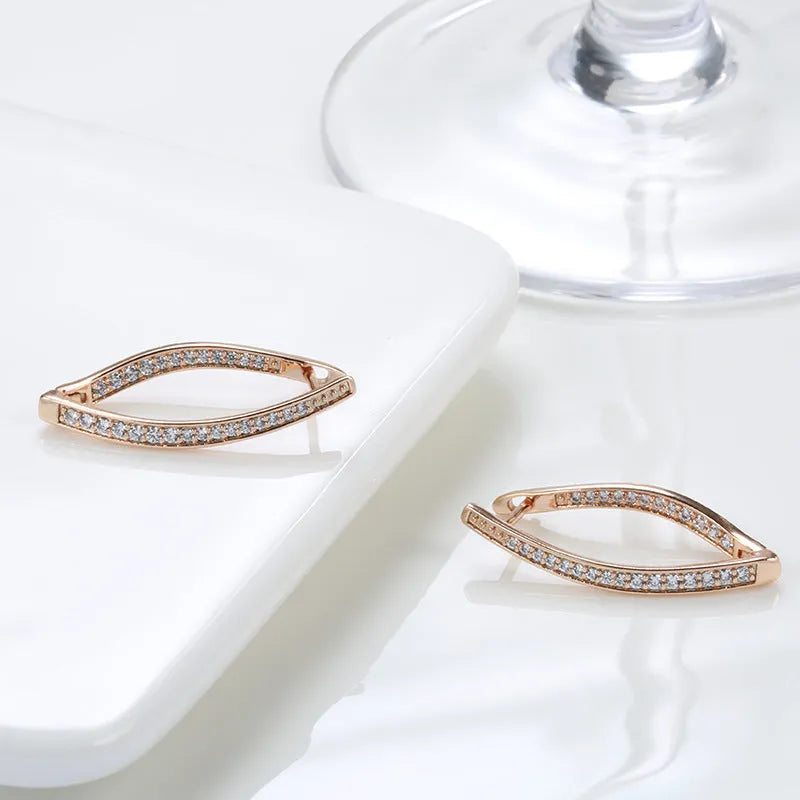 Pair of H0493 copper geometric drop earrings with zircon accents for women on light background