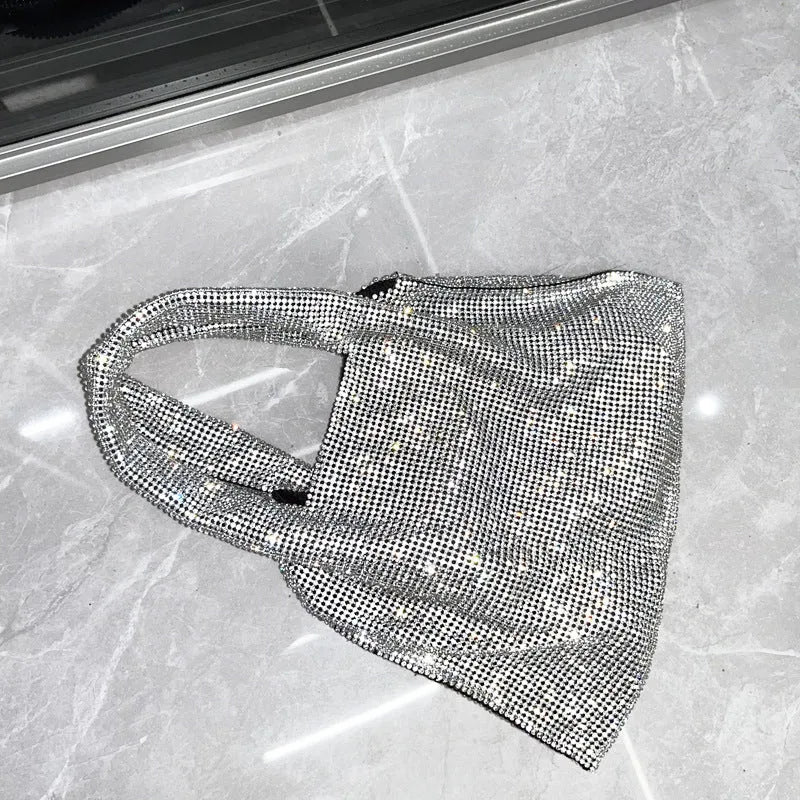 Silver evening handbag with shiny rhinestone decoration and cotton thread construction