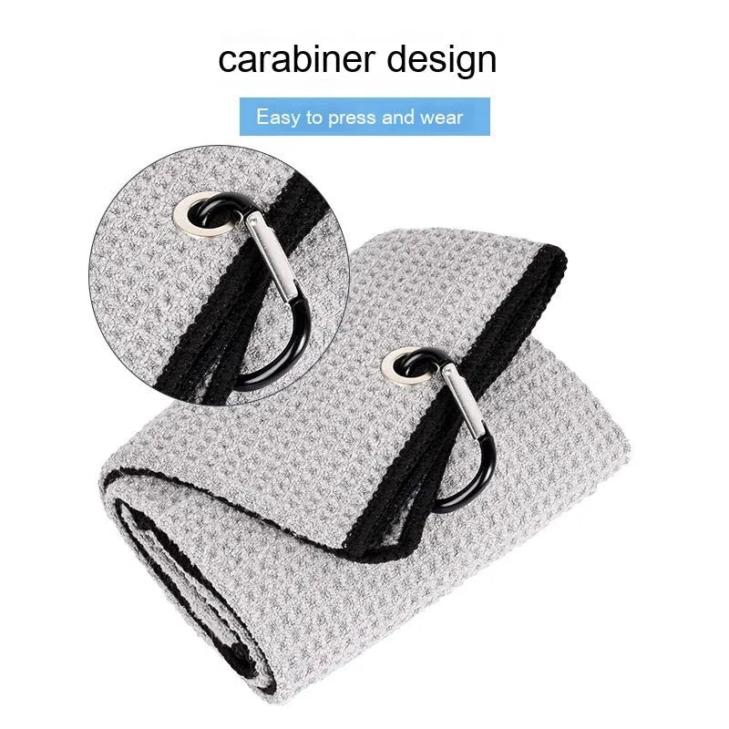 Waffle weave golf ball cleaning cloth towel in assorted colours showing textured surface.