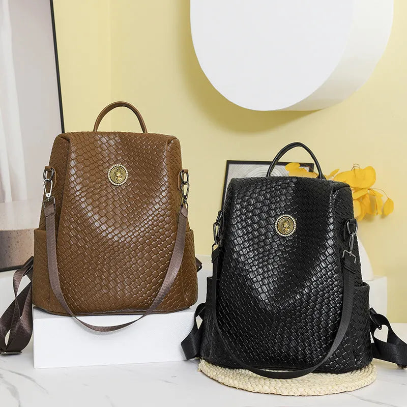 Women's black anti-theft backpack with organisational compartments and urban design details