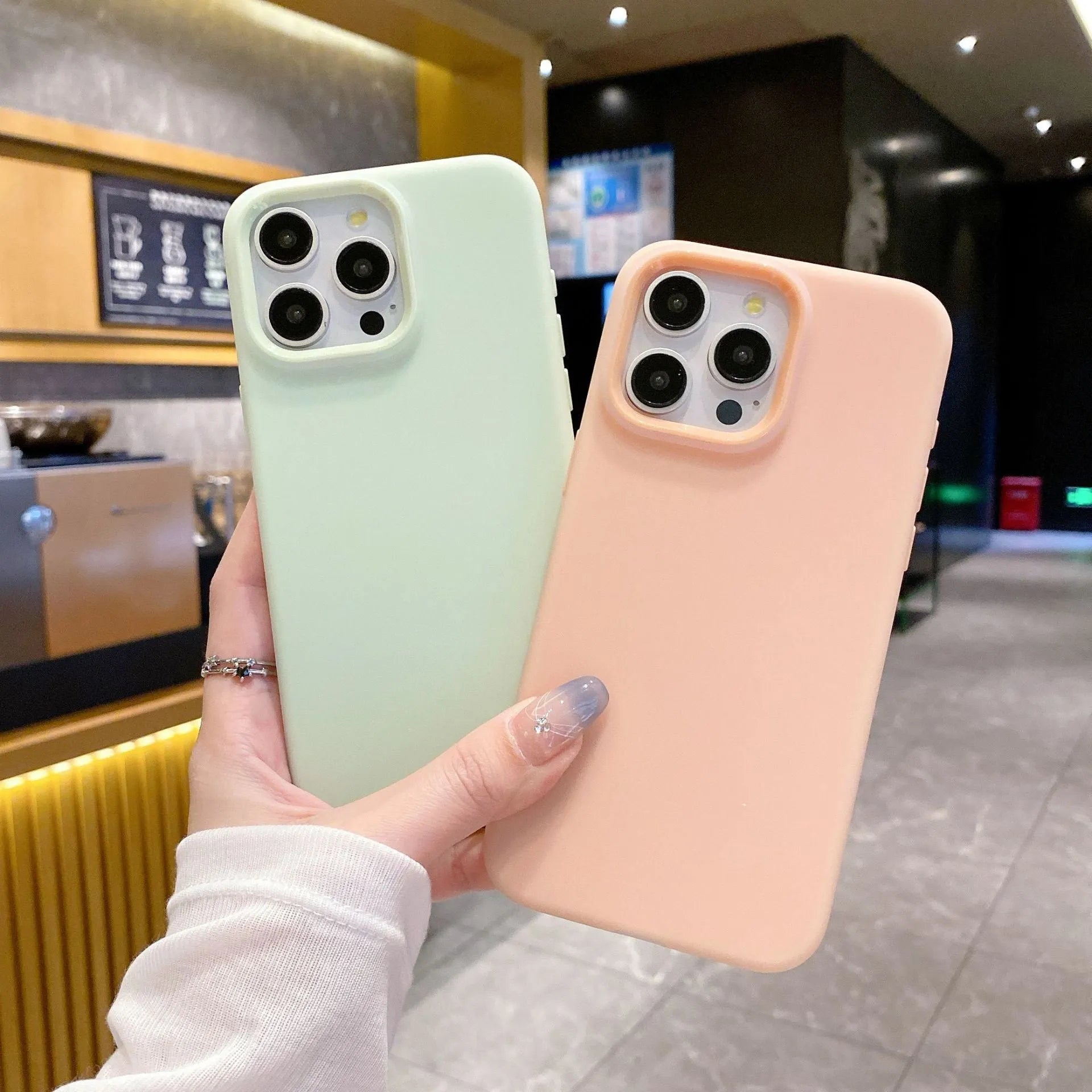 Liquid silicone dopamine phone case for Apple iPhone in blue, purple, and orange colour options