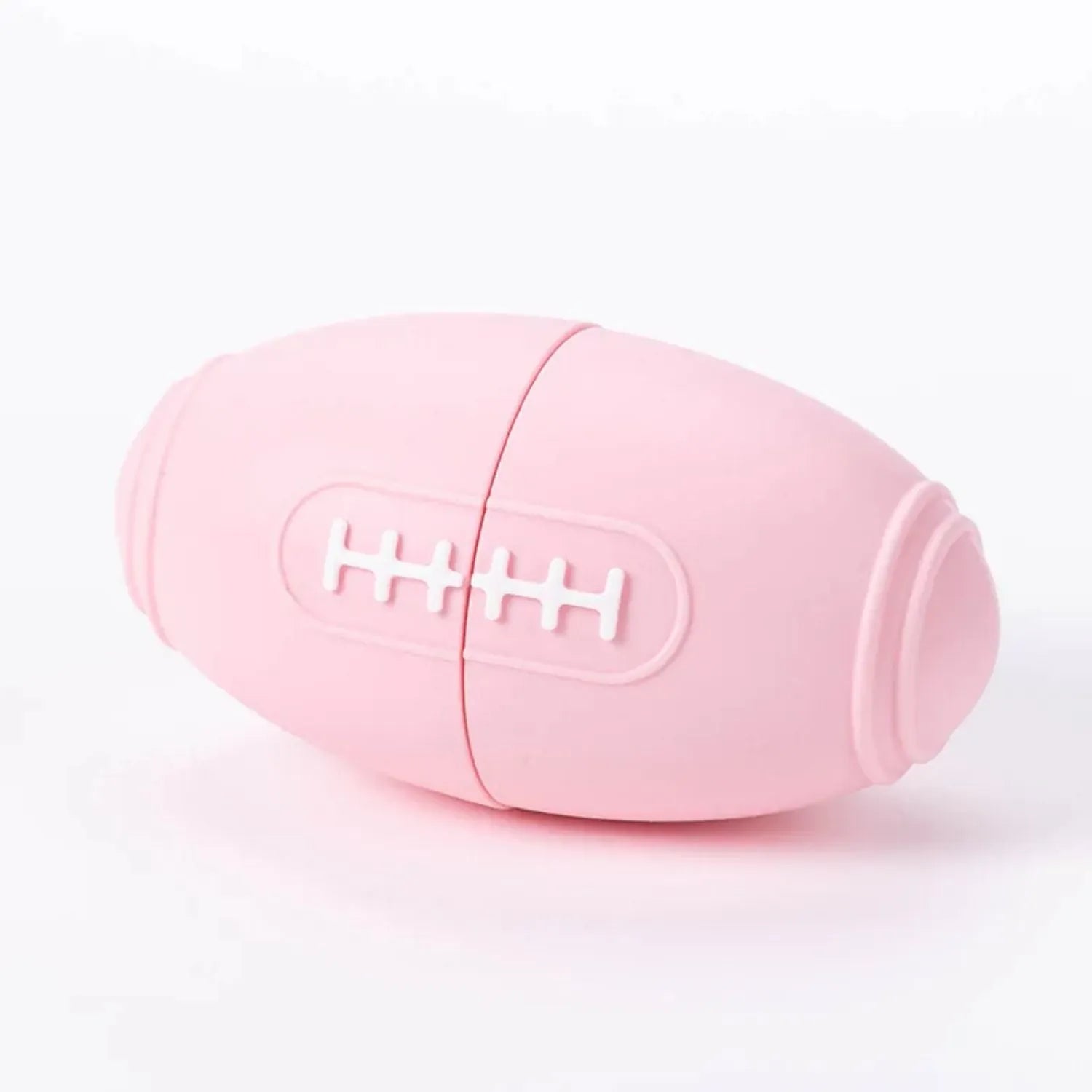 Blue silicone rugby ball dog toy with hollow centre for treat dispensing