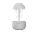 White USB rotating colorful light humidifier with large mist output on a desktop surface
