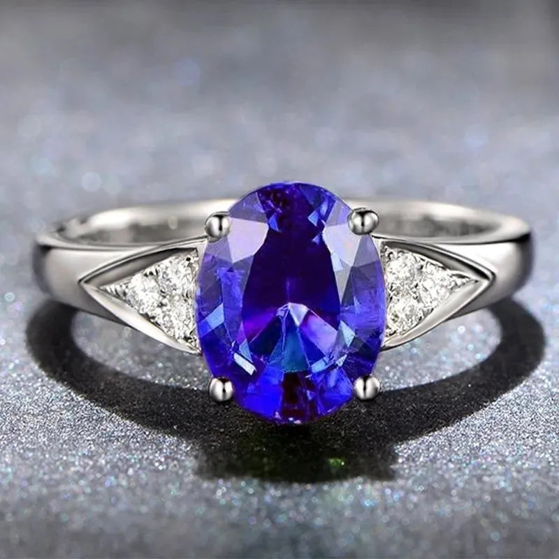 Women's court style ring with natural zircon inlay showing heart, water drop, and bell pattern options in red, blue, green, and light blue.