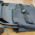 Large black aluminium alloy foldable pet stretcher for dog emergency transport.