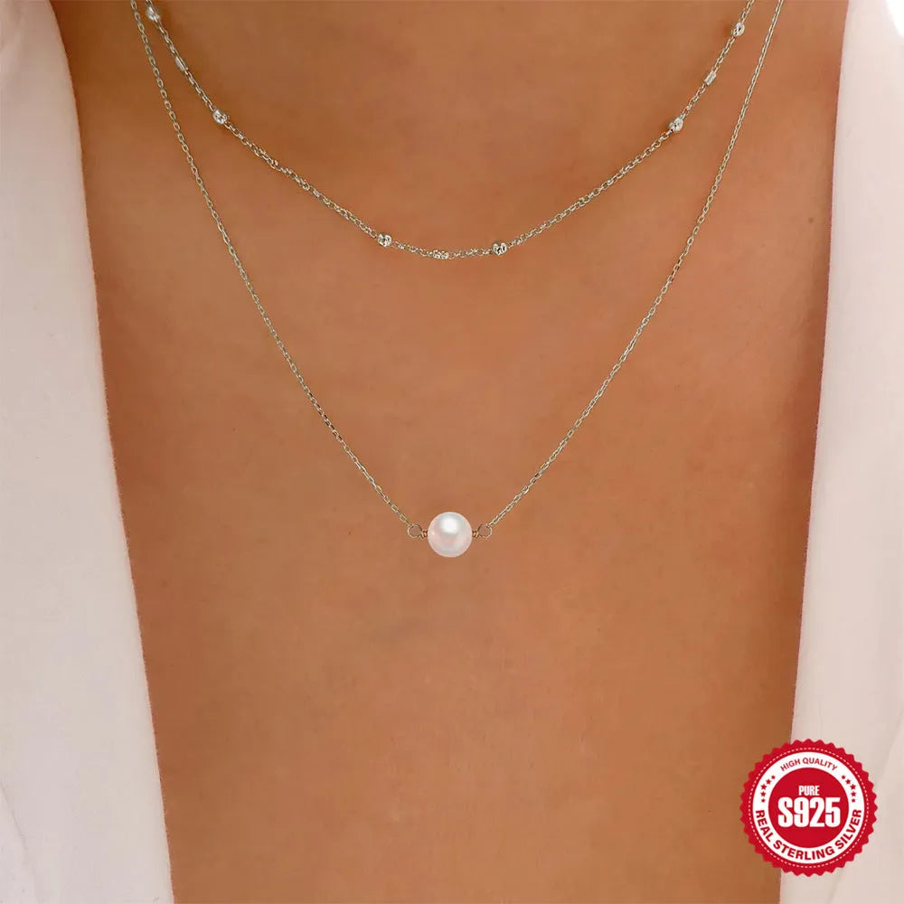 S925 sterling silver double layer necklace with twin pearl geometric pendant on a ball bead chain.