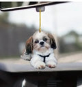 Acrylic plastic decorative pendant for car dashboard in a cartoon style design.