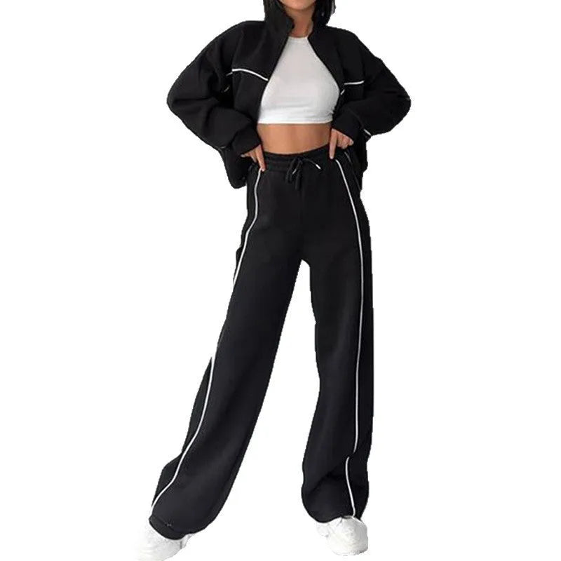 Casual polyester suit set showing a long sleeve mock neck hoodie and striped trousers on a model.