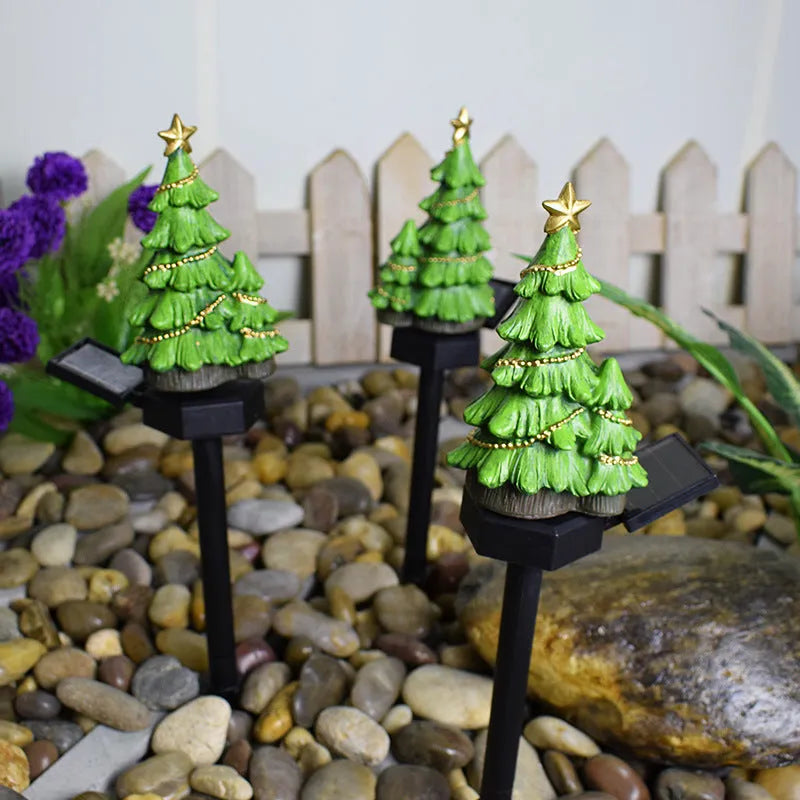 Solar powered Christmas tree shaped ground plugged lawn lamp with resin body and solar panel for outdoor garden decoration