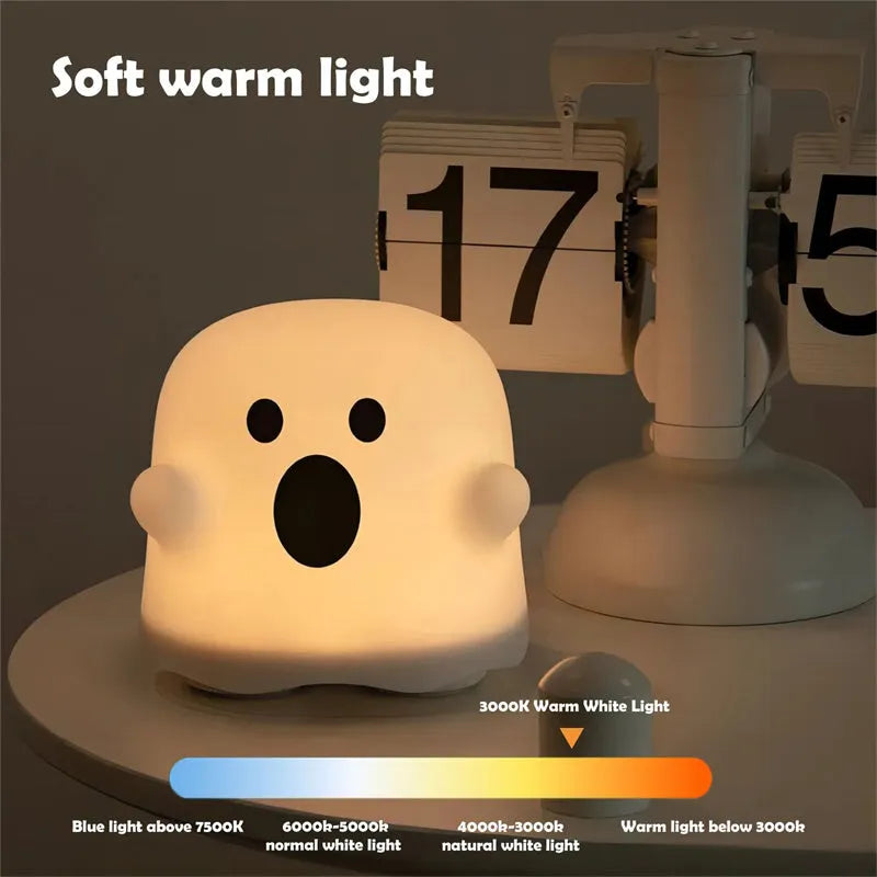 Silicone touch sensor LED night light on a bedside table showing soft glow.