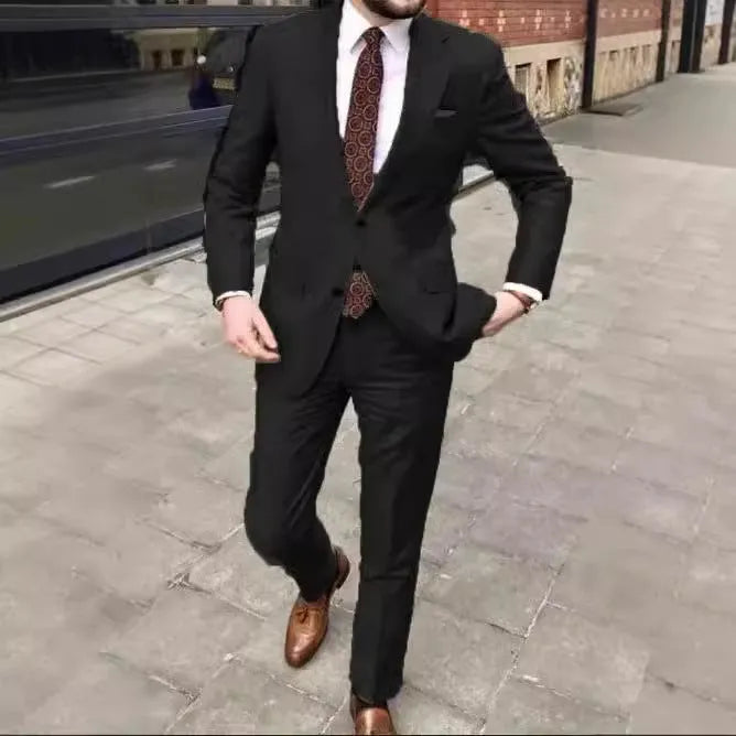 Men's slim fit two-button business suit jacket and trousers on a hanger