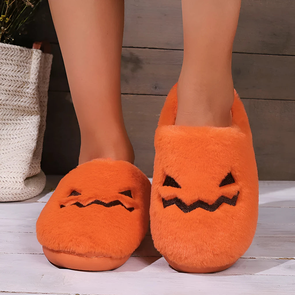 Orange pumpkin-shaped plush slippers with coral velvet upper on a non-slip PVC sole