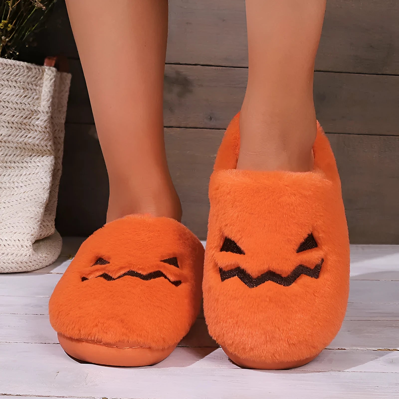 Orange pumpkin-shaped plush slippers with coral velvet upper on a non-slip PVC sole
