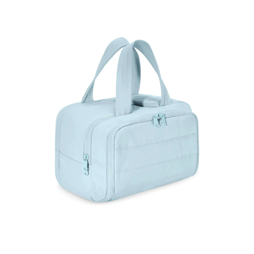 A large, open-topped lightweight travel toiletry bag in a choice of colours, showing its spacious interior.