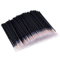 Pack of 100 black disposable eyeliner brushes with fine points and plastic protective sleeves.