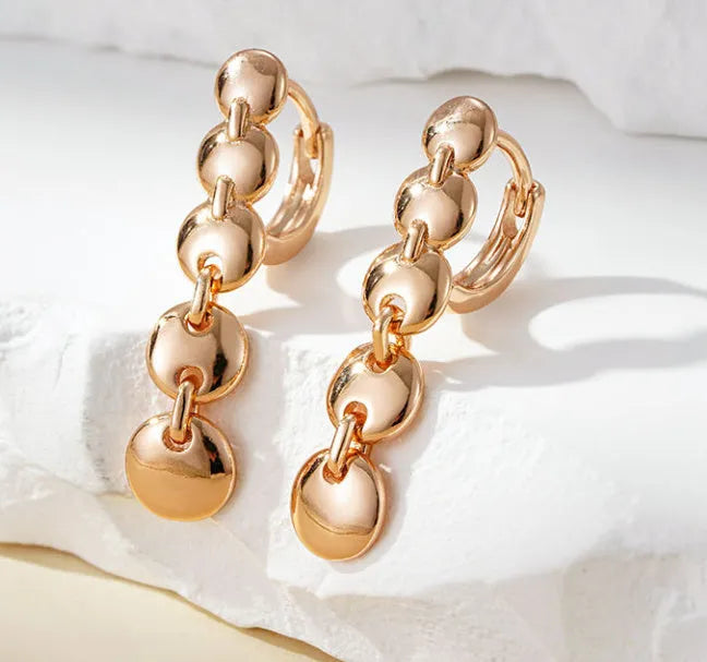 Retro gold woven circle earrings with copper construction and 4.5 cm diameter