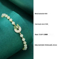 Cyan Hetian jade bracelet with sterling silver butterfly design and gemstone inlays on wrist