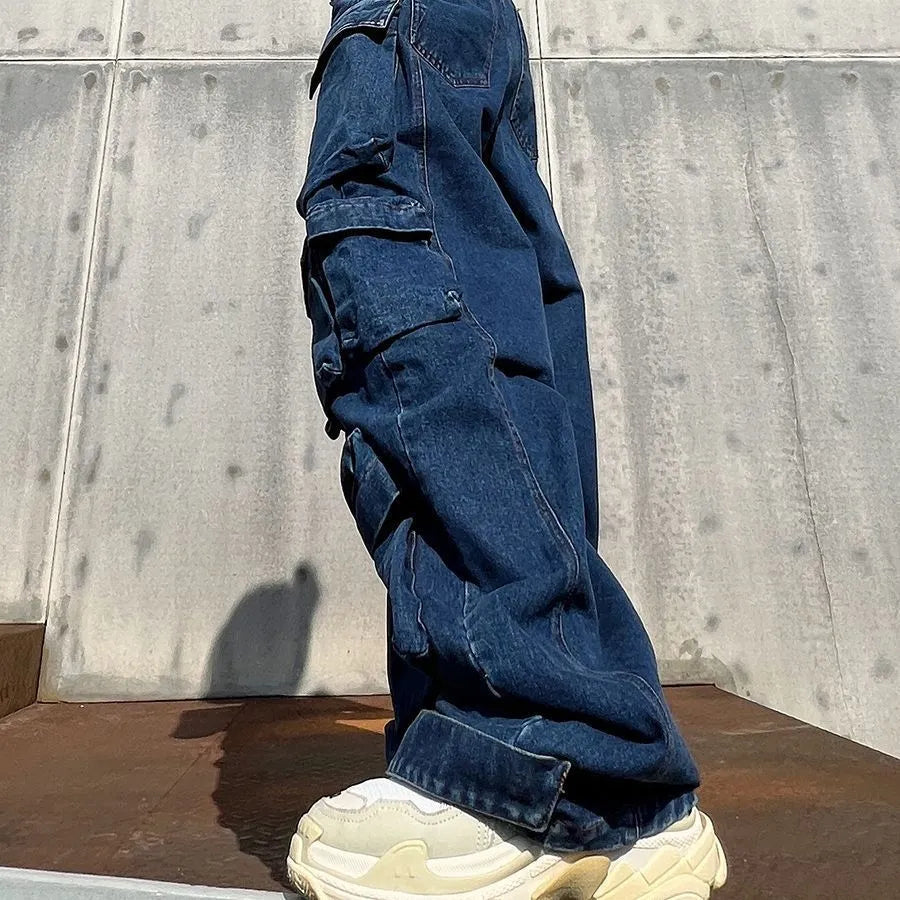Dark blue distressed wide-leg jeans with a high waist and multiple pockets laid flat