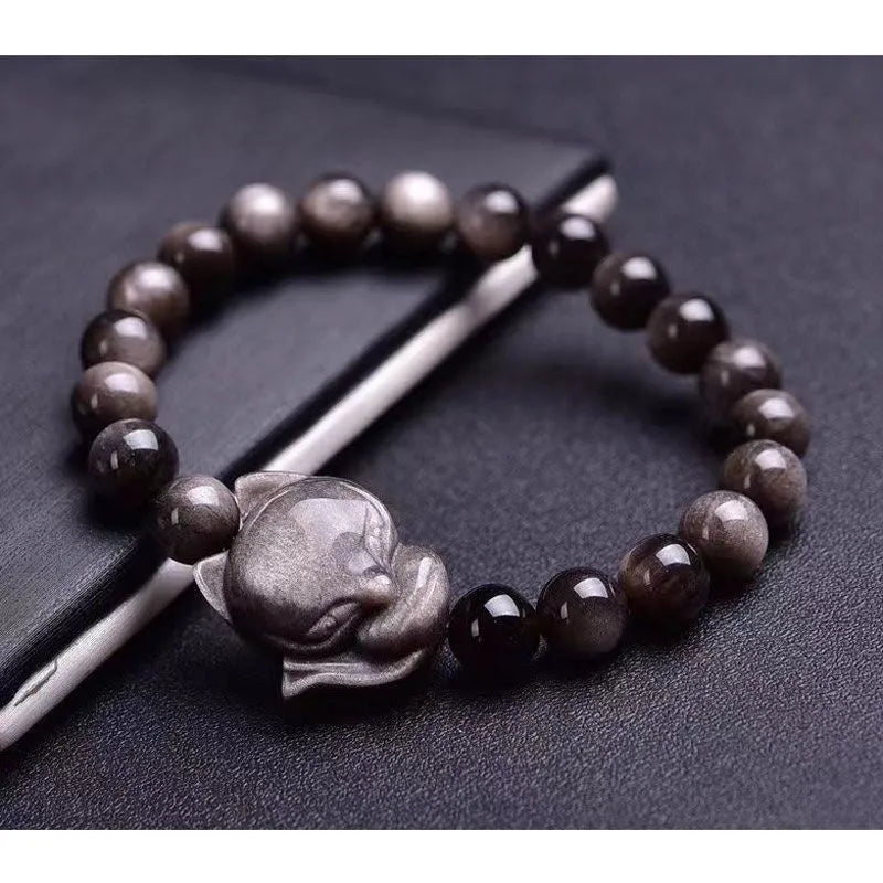 Obsidian fox bracelet with 8mm black stone beads and silver-toned fox charm on wrist