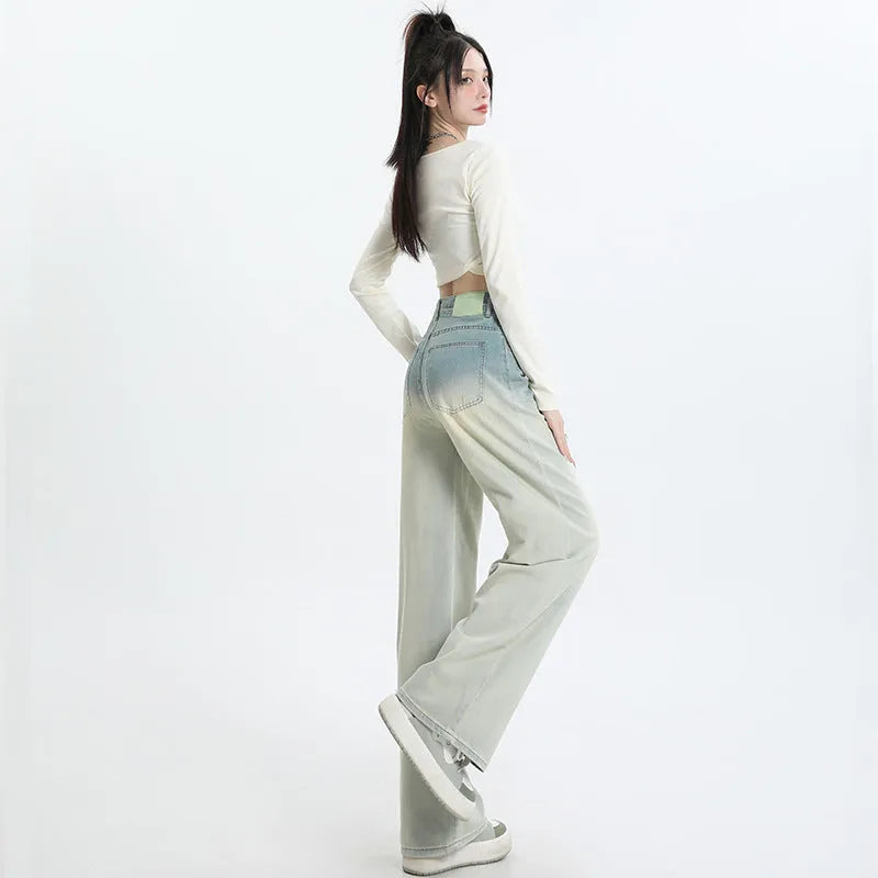 Women's gradient blue straight-leg wide-leg denim trousers laid flat.