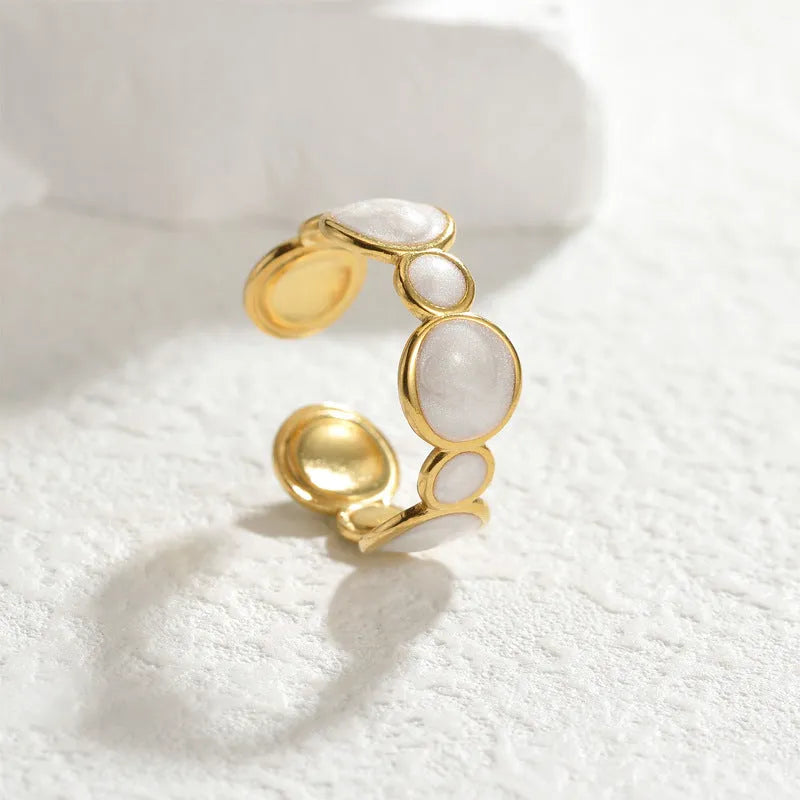 Stainless steel geometric ring with an adjustable opening band for women.