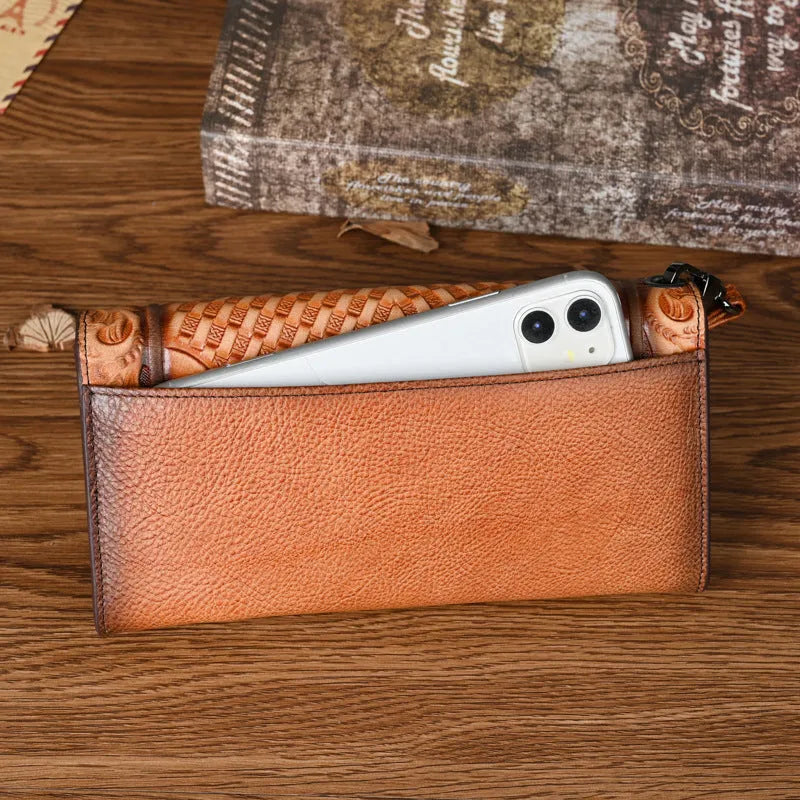 Chinese style brown embossed floral tri-fold women's wallet made from first layer cowhide, shown open and closed.