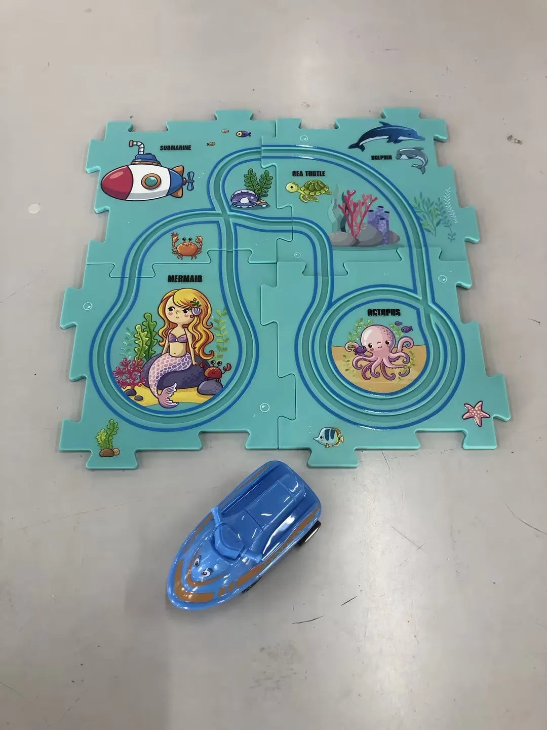 Children puzzle electric railroad speeder DIY assembly track set with automatic car and plastic pieces in multiple themes