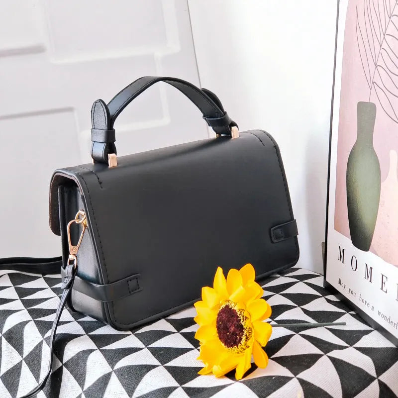 Retro small square pattern crossbody bag in apricot colour, showing horizontal square shape and stitching detail.