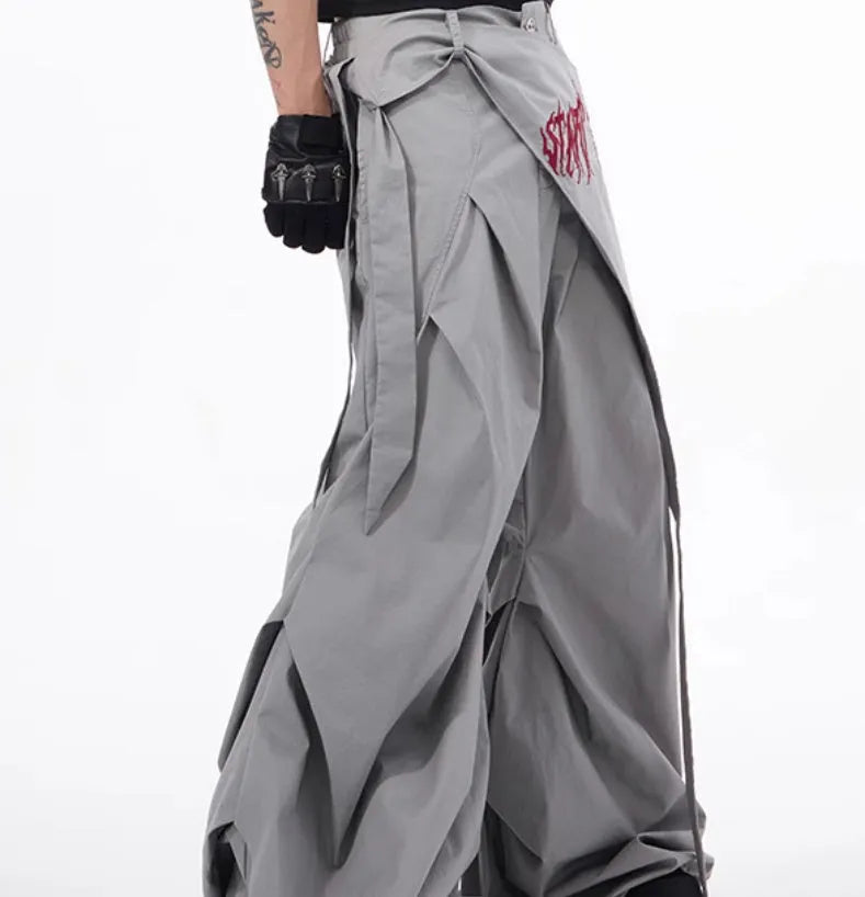 Boy modelling black Korean-style wide-leg summer trousers in a casual setting.