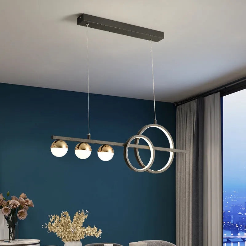 Modern rectangular aluminium ceiling light in black or gold with remote control on a white background.