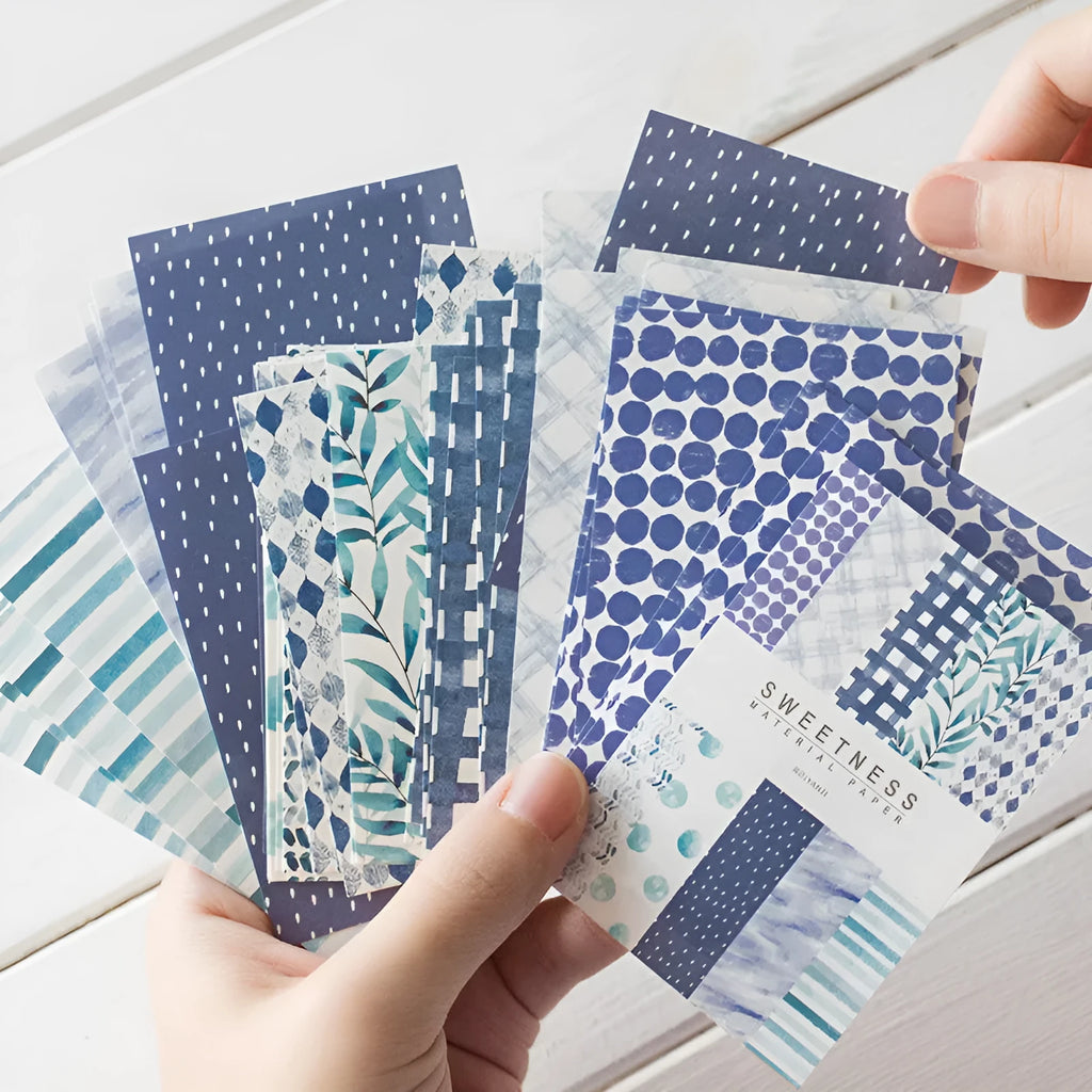 Pack of 50 colourful retro collage note papers in sweet light dessert colours, each measuring 56 by 83 millimetres.