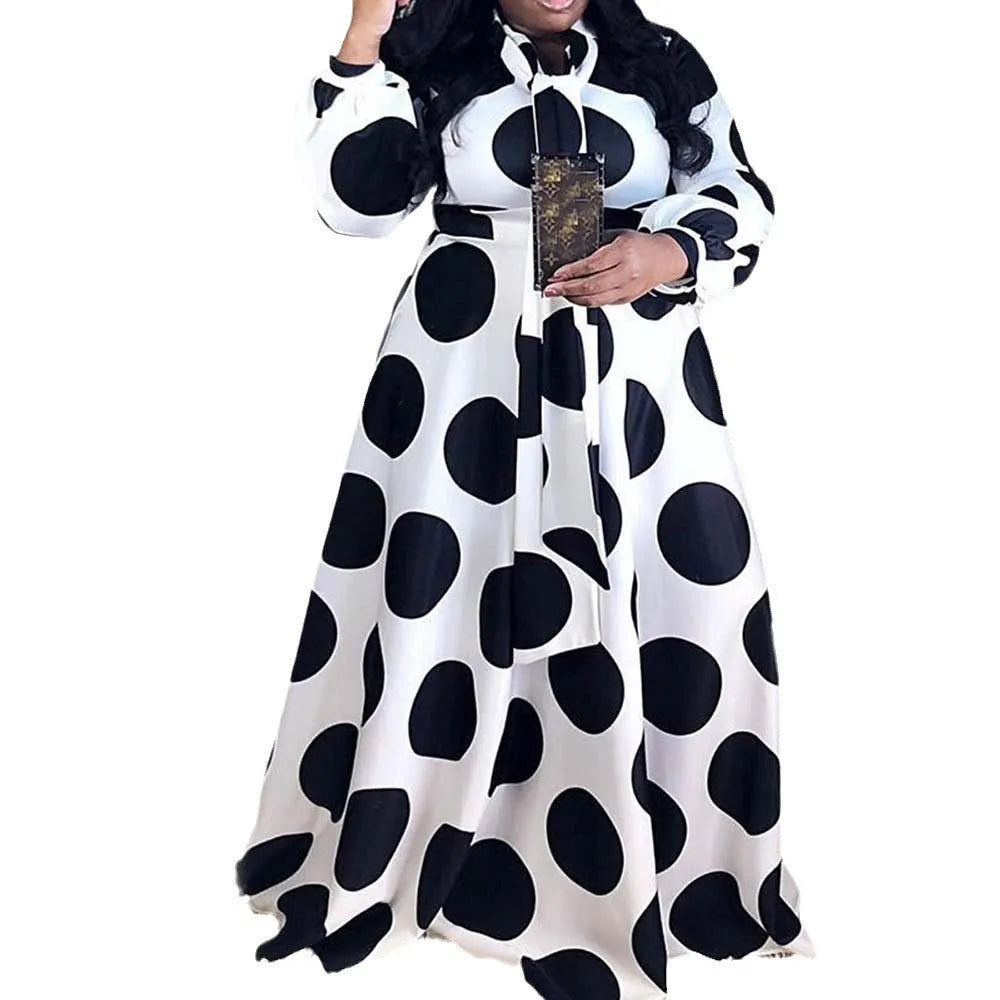 Women's large size white polka dot dress with long sleeves and long skirt, front view