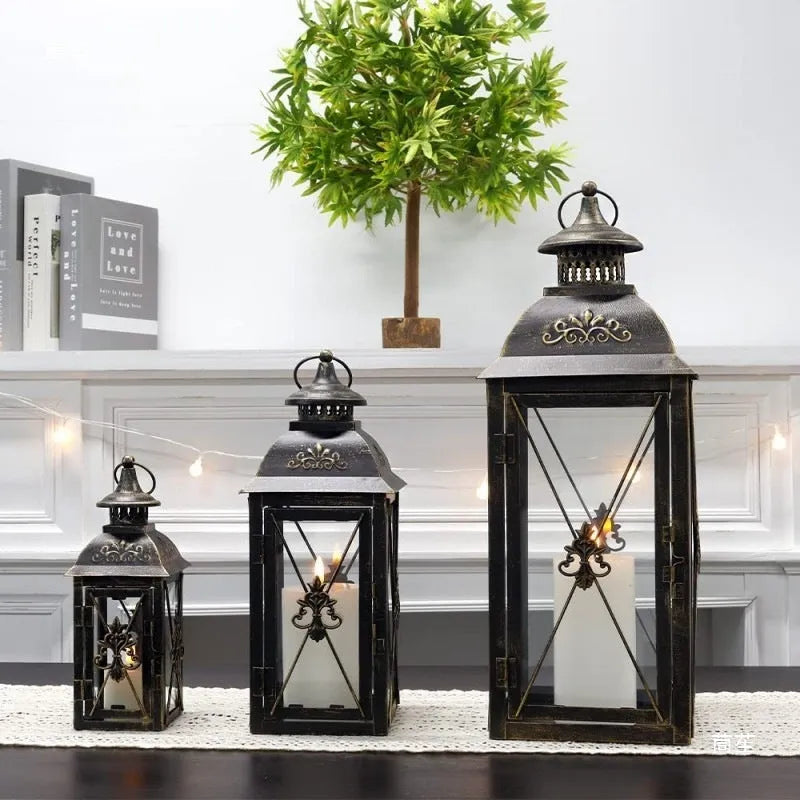 Wrought iron floor-standing storm lantern with tempered glass in black gold brush finish