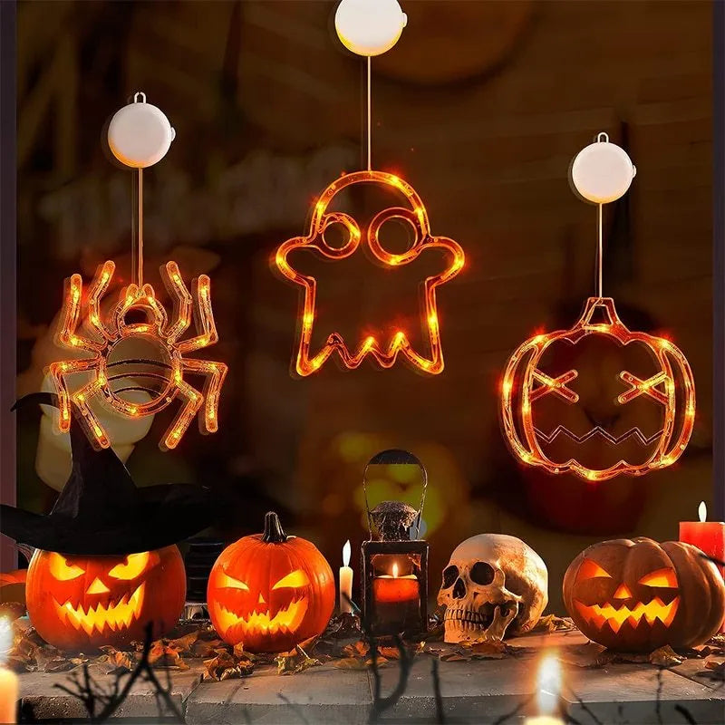 Seven Halloween LED hanging lights with spider, pumpkin and ghost designs featuring suction cups