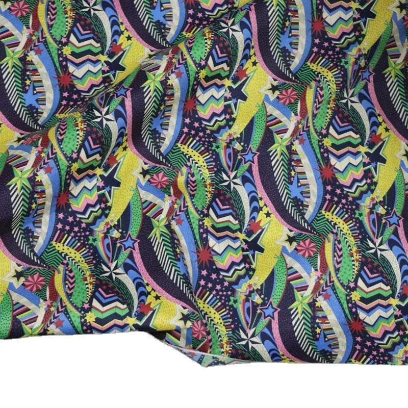 Blue plant and flower pattern on 100% cotton fabric, showing the 145 cm width.