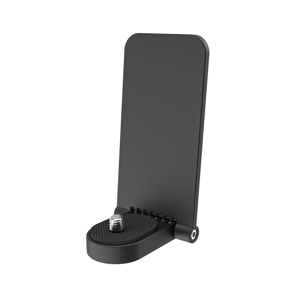 Black magnetic bracket base and handle accessory for Insta360 X4 camera on a desktop