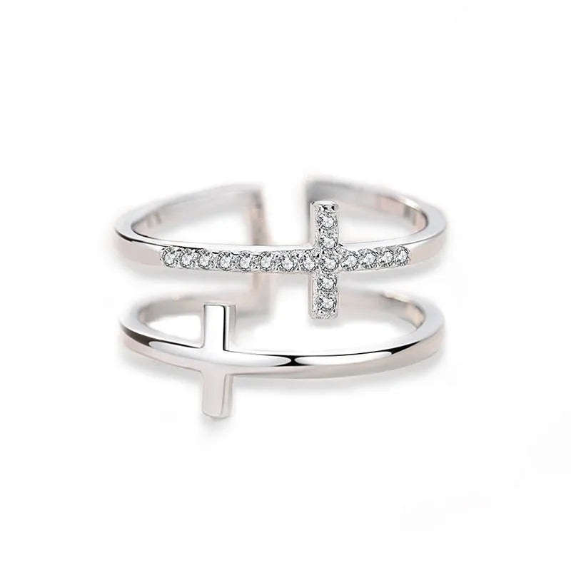Adjustable copper ring with sterling silver inlay and white gold finish, featuring a zircon stone.