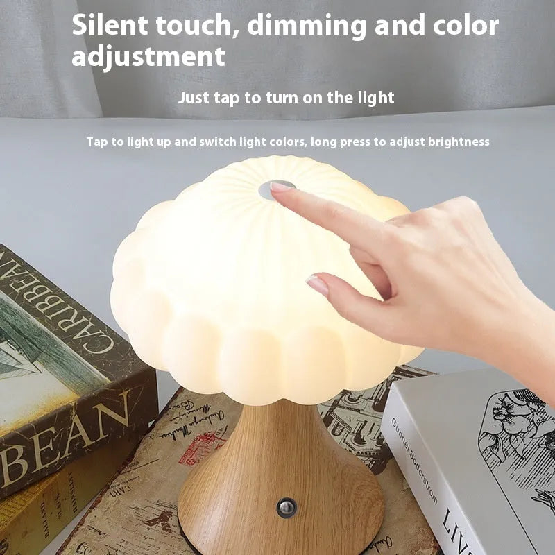Small mushroom-shaped touch sensor night light showing USB charging port and woodgrain colour finish.