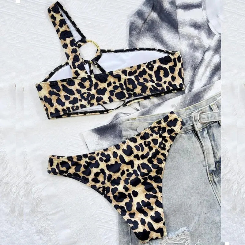 Women's hollow leopard print with polka dots bikini top and shorts set on a mannequin.