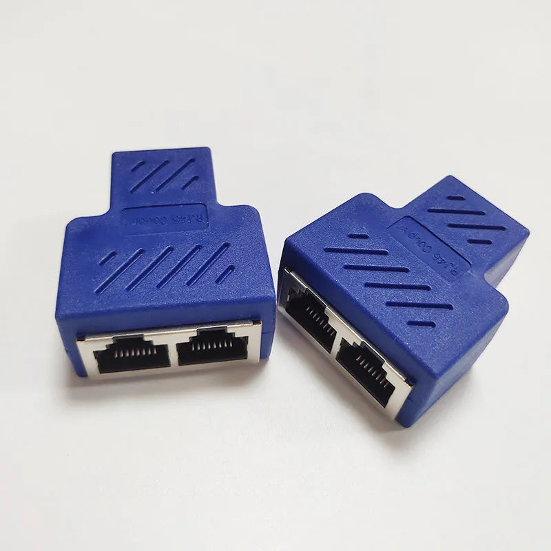 A white RJ45 network splitter adapter with one male and two female Ethernet ports.