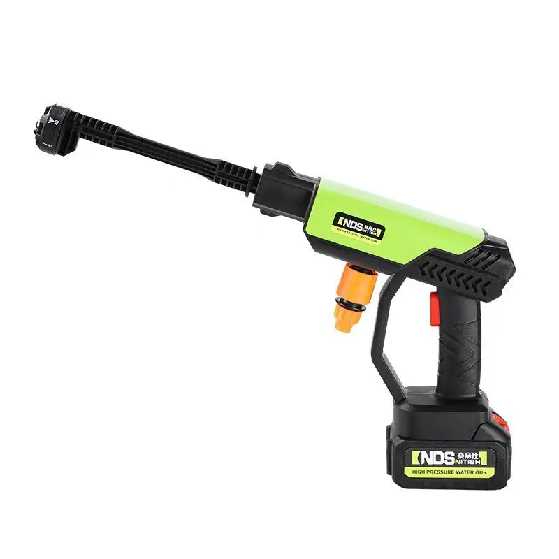 Green wireless high-pressure water gun with metal head and six-in-one nozzle, next to its battery, charger, and accessories on a grey background.