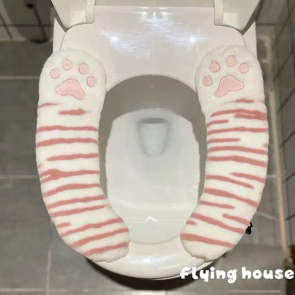 Plush toilet seat cushion with adhesive Velcro fastener in black and white stripes for bathroom use