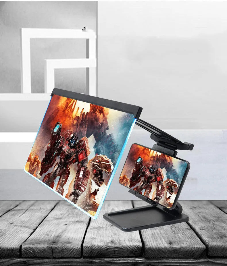 Black folding mobile phone screen magnifier with detachable holder next to an iPhone.