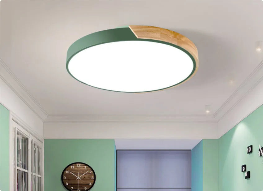 Round macaron LED ceiling light in white with plastic shade for bedroom use