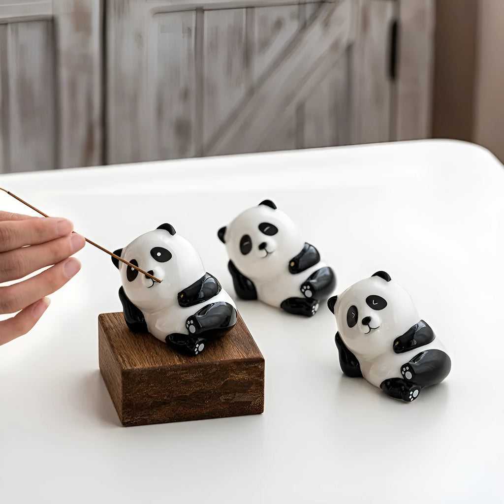 Ceramic panda incense burner with closed eyes on a desk, 8.5cm tall, for office aromatherapy