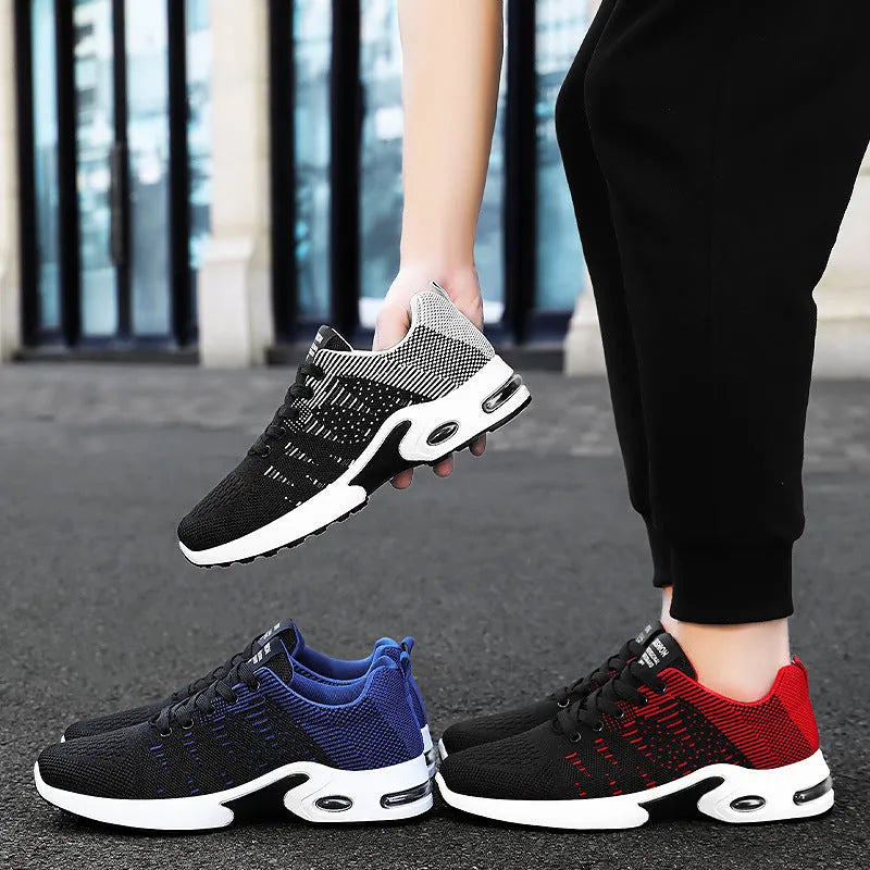 Men's low-top black and gray Flyknit mesh casual sneakers with lace-up front and round toe.
