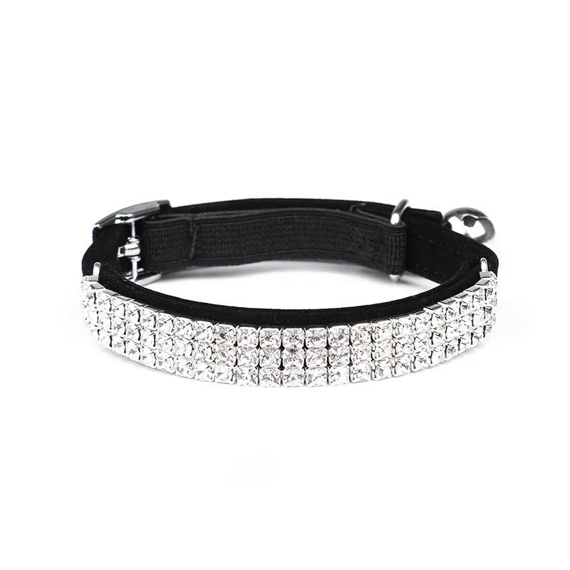 Red velvet cat collar with rhinestones, showing adjustable buckle set to a 25cm length.